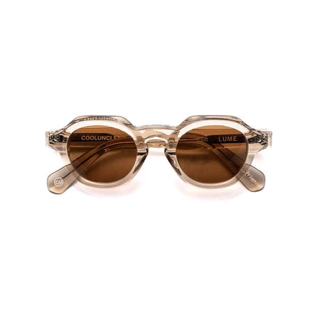 Sunglasses by Cool Uncle with brown lenses and gold frames on a white background