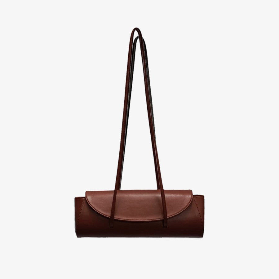 A dark brown, solid-colored handbag with a shoulder strap and a zipper closure by Masagi.