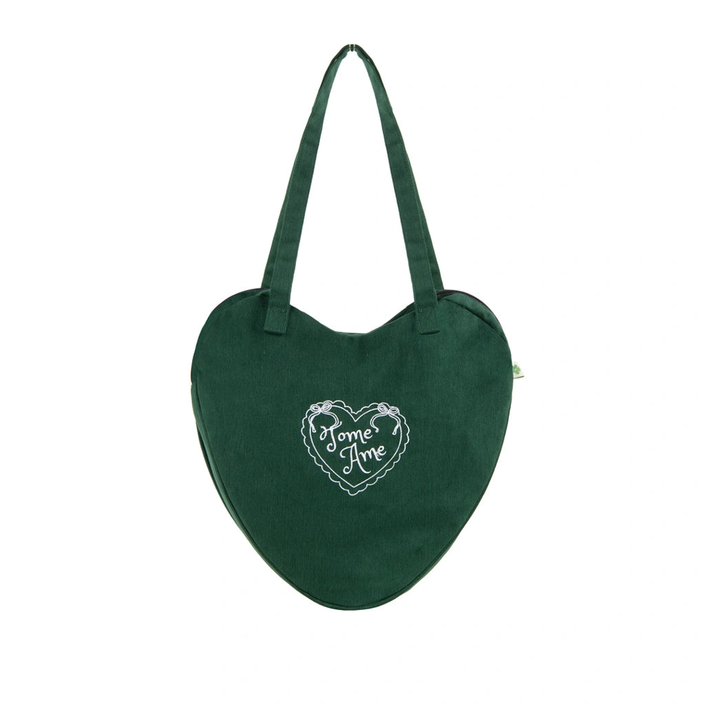 Green heart-shaped bag with 'Tome Ame' embroidery on a white background