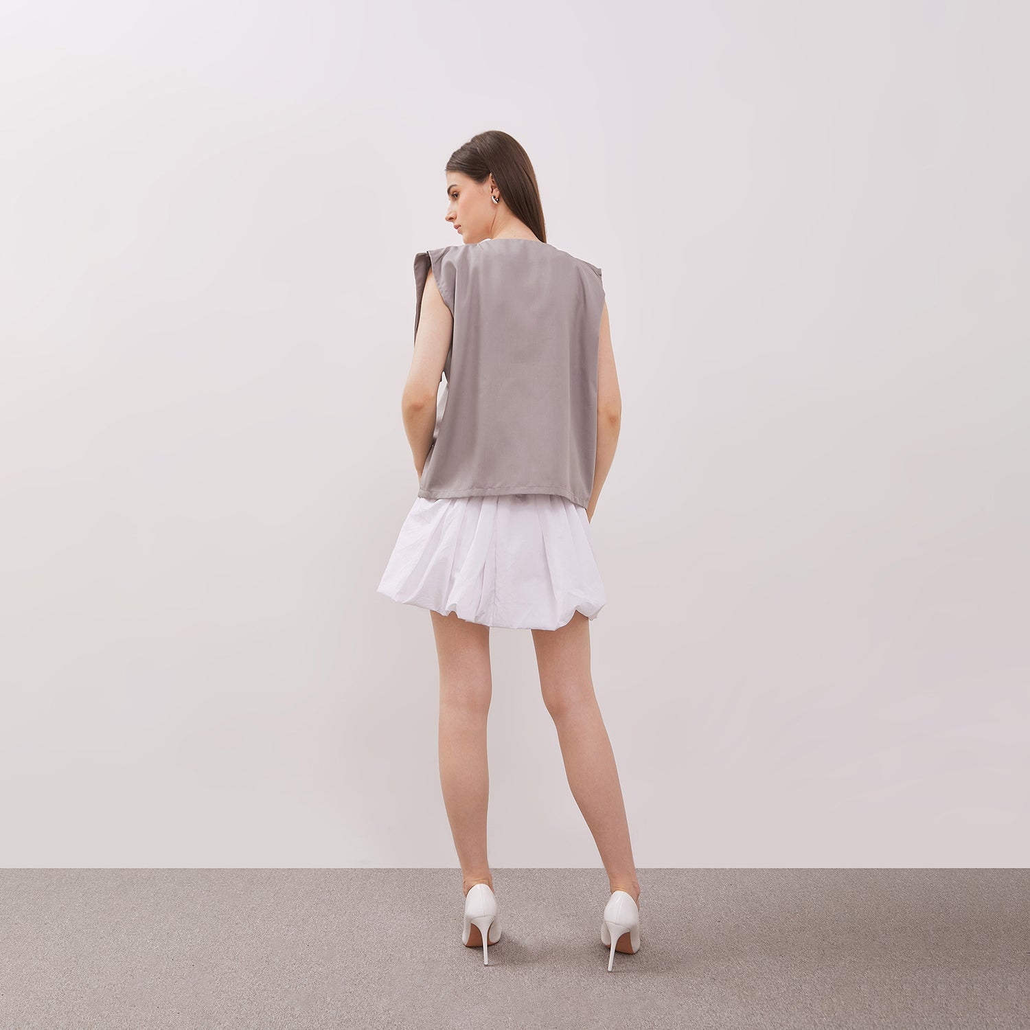 A back view of Grey Athena Vest from Isoos Studios
