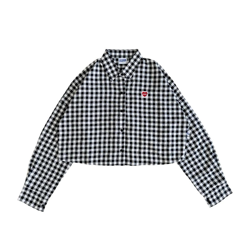 A black and white checkered long-sleeved Brixton shirt by notyourcompany with a collar, button-up front, and a cropped fit.