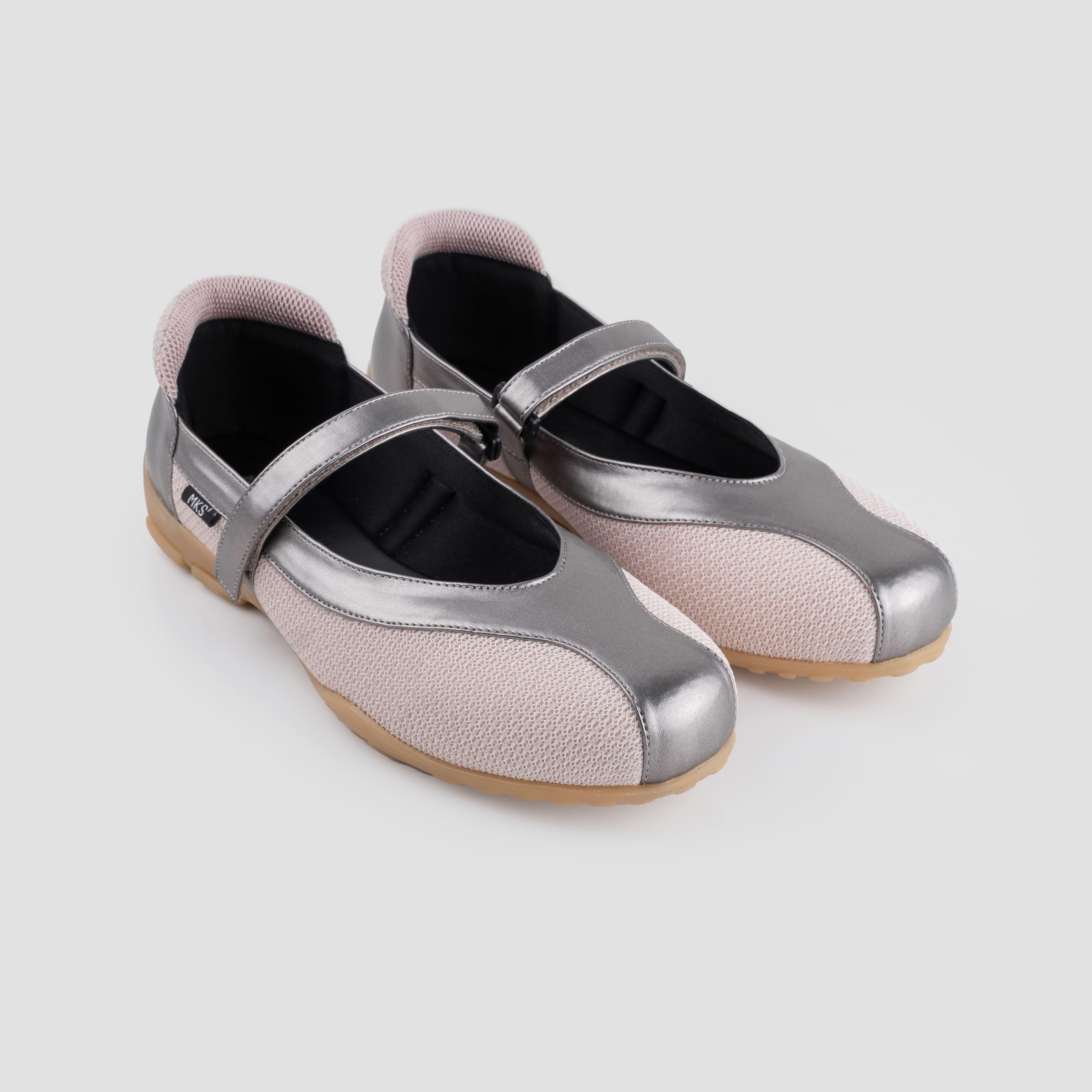 Pair of silver and pink mary jane flatshoes by Mks Shoes on a light gray background