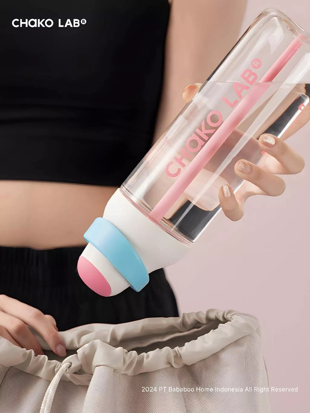 Clear bottle with pink and blue accents held by a person, featuring 'Chako Lab' branding.