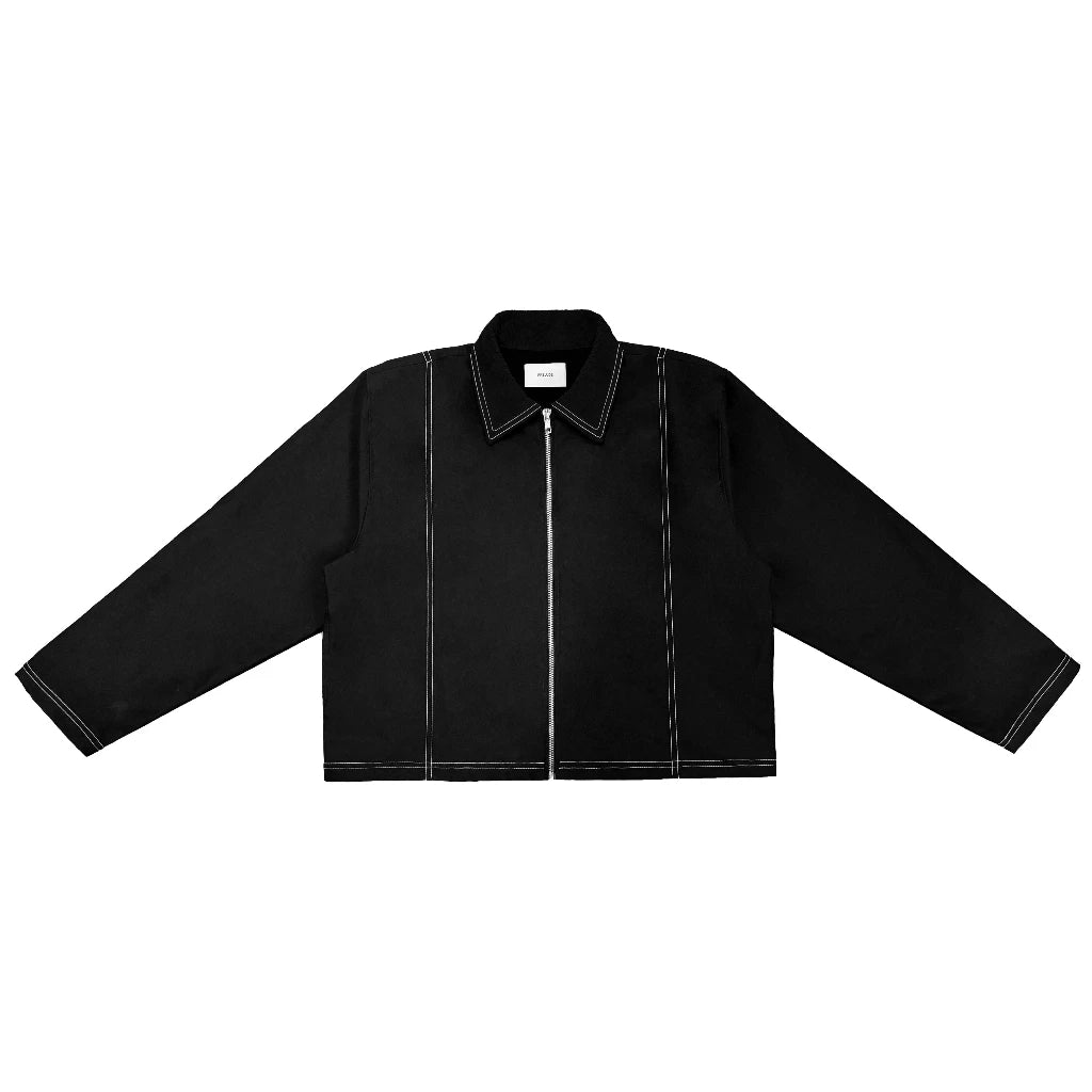 Black work jacket with a cropped oversized fit, front zipper closure, and contrast white stitching details. Features a minimalist structured design suitable for casual and contemporary outfits.