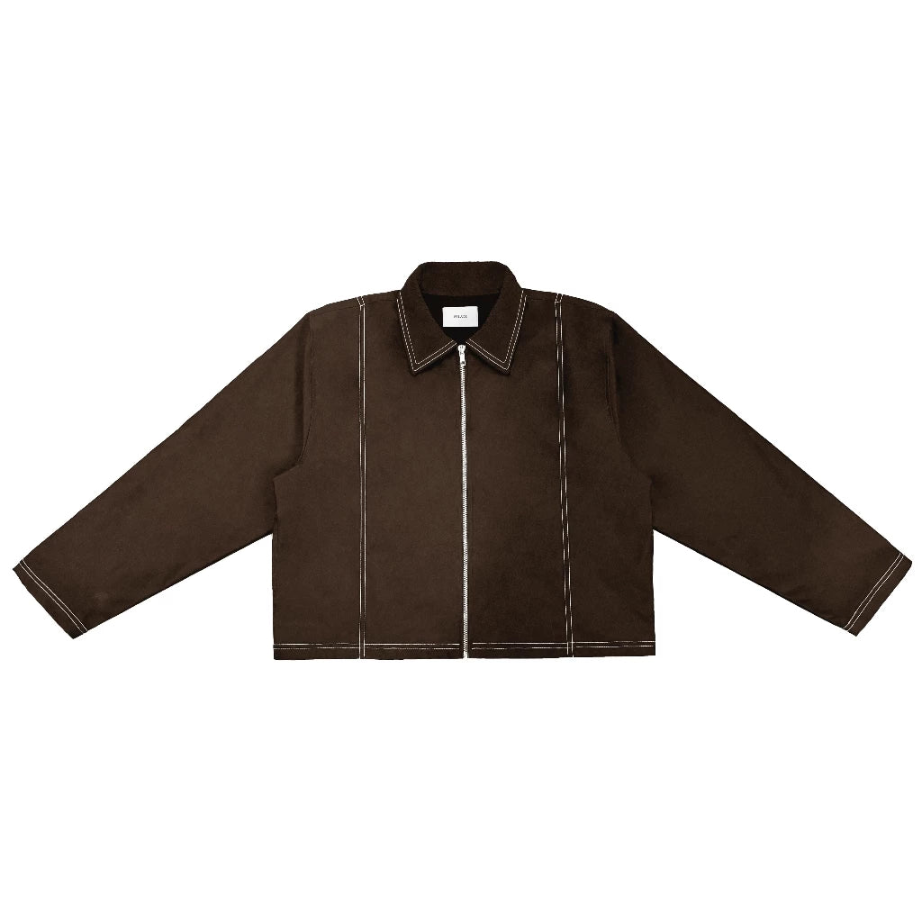 Brown work jacket with a cropped oversized fit, front zipper closure, and contrast white stitching details. Features a minimalist structured design suitable for casual and contemporary outfits.