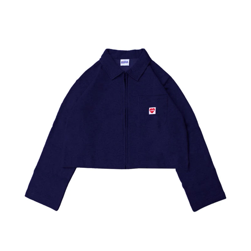 A navy crop jacket with a collar, long sleeves, and a front pocket, featuring a small red logo on the chest by notyourcompany.