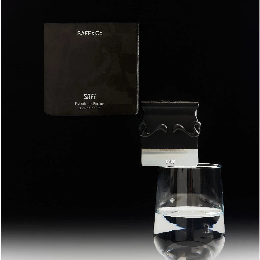 SAFF & Co. perfume bottle and packaging on a black background