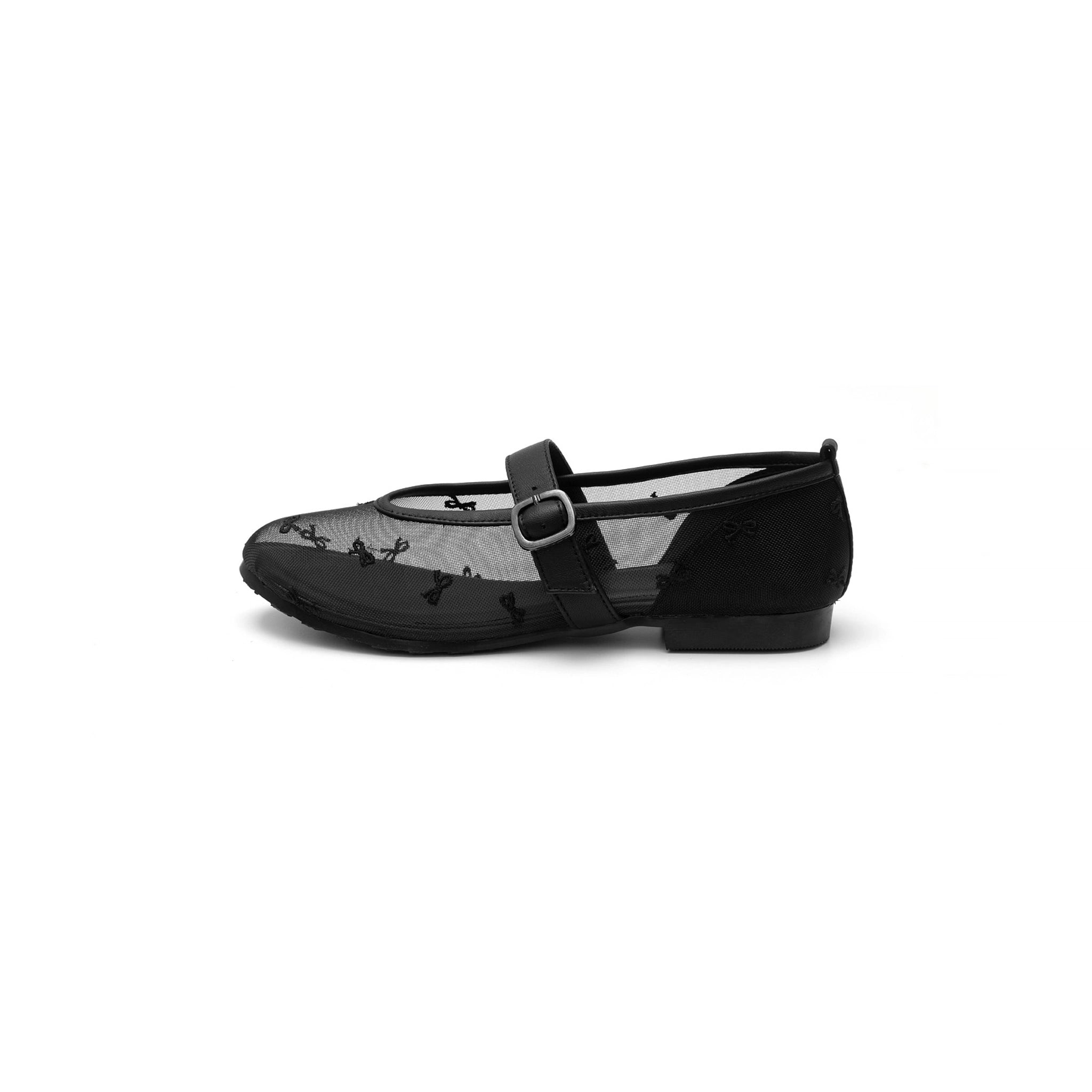 A black ballet flat with a Mary Jane strap and a mesh design, featuring a buckle closure.