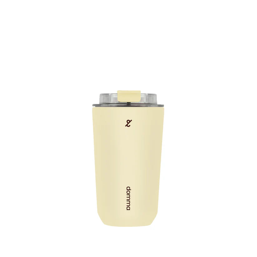 Light yellow travel mug with a clear lid by Domma on a white background