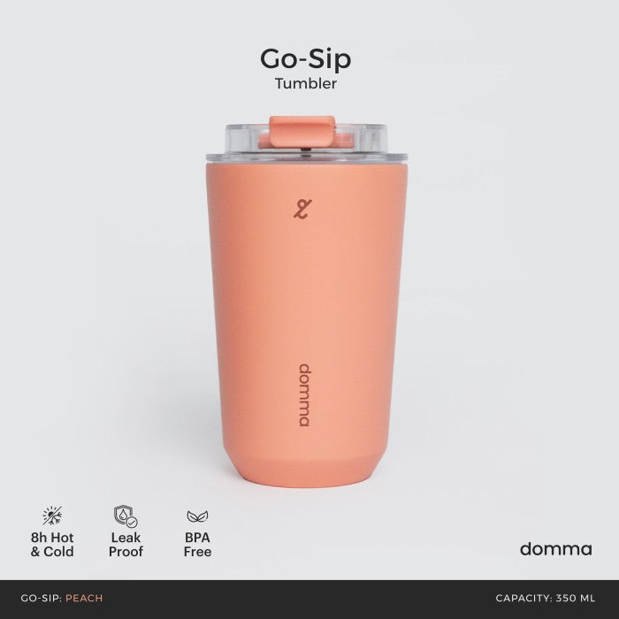 A peach stainless steel insulated travel mug with a Domma brand logo on the front.