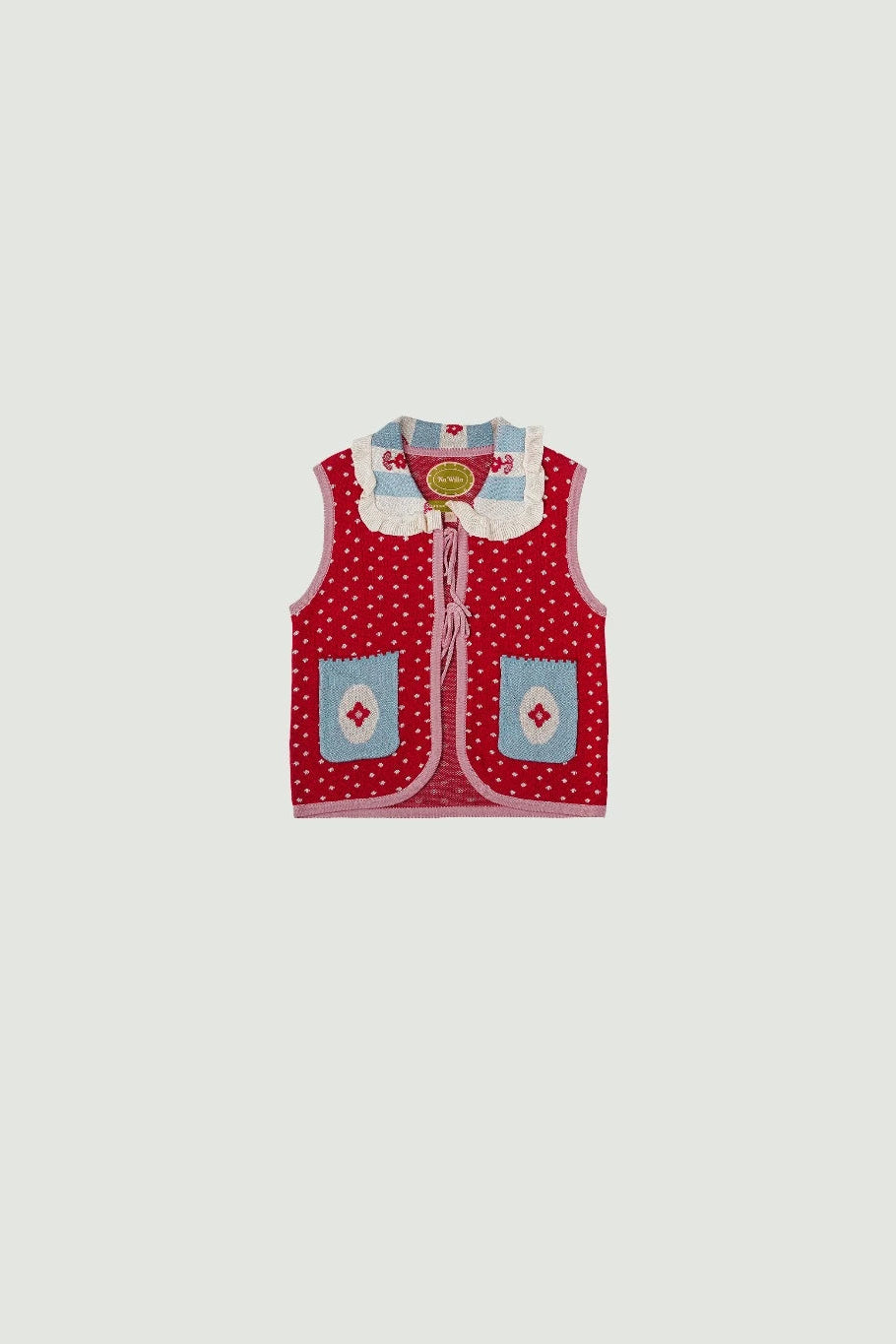 Red polka dot vest with blue accents by Sabine & Heem kids clothing on a white background