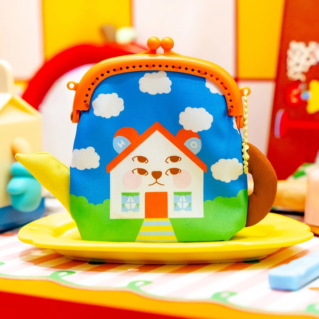 Colorful children's purse by Oh.Irv with house design on a yellow plate