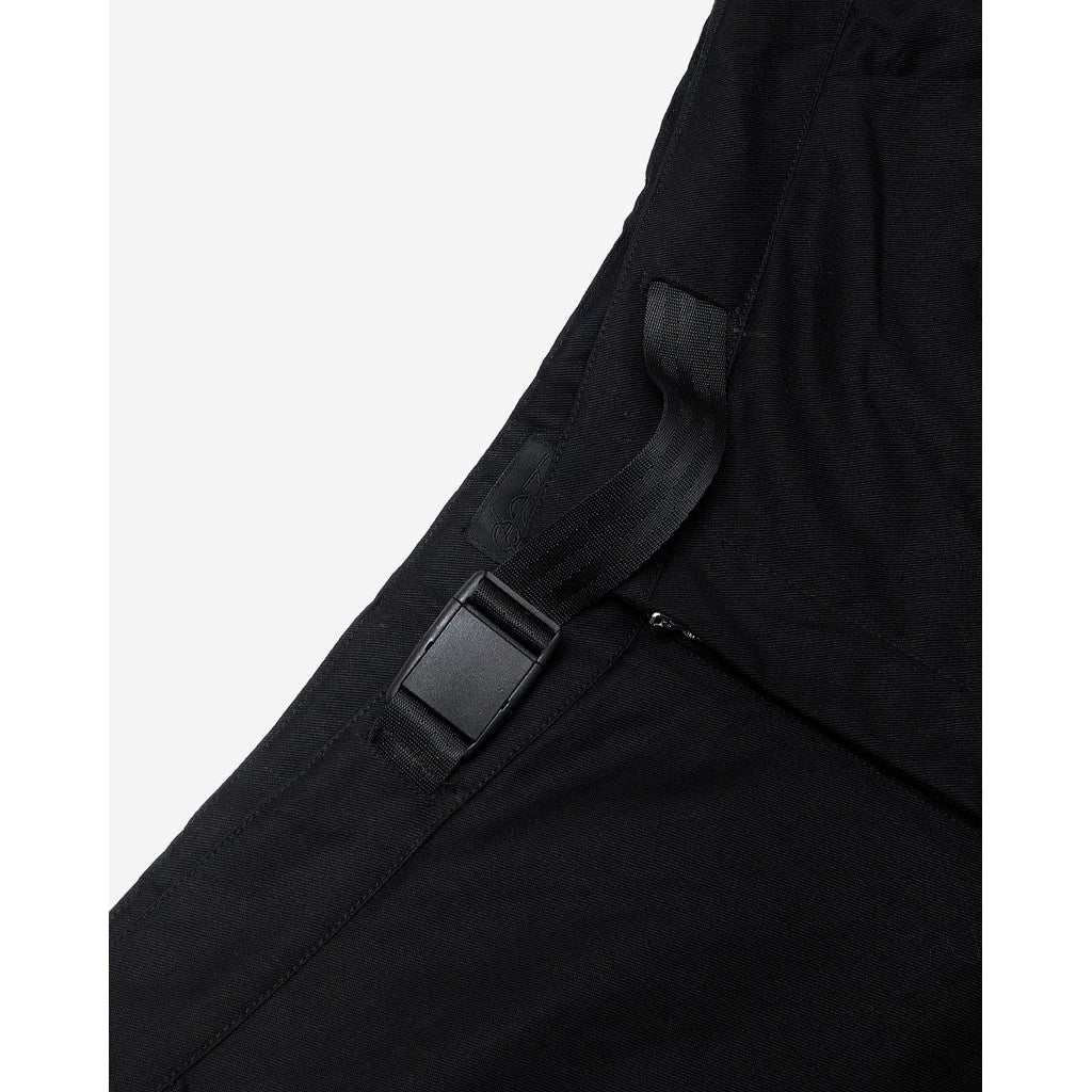 Close-up of a black barrel pants with a strap and buckle on a white background