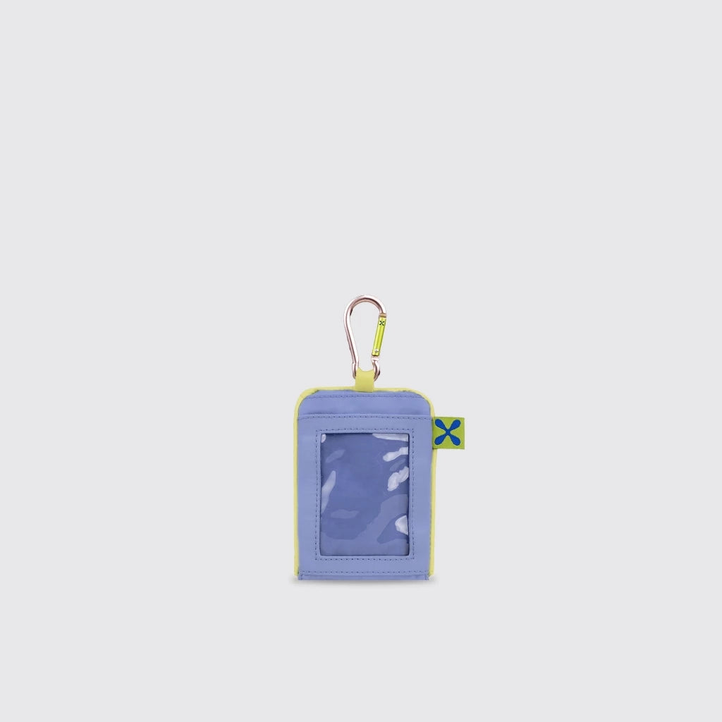 Light blue keychain card holder by Exsport with a small flag brand logo on a light gray background