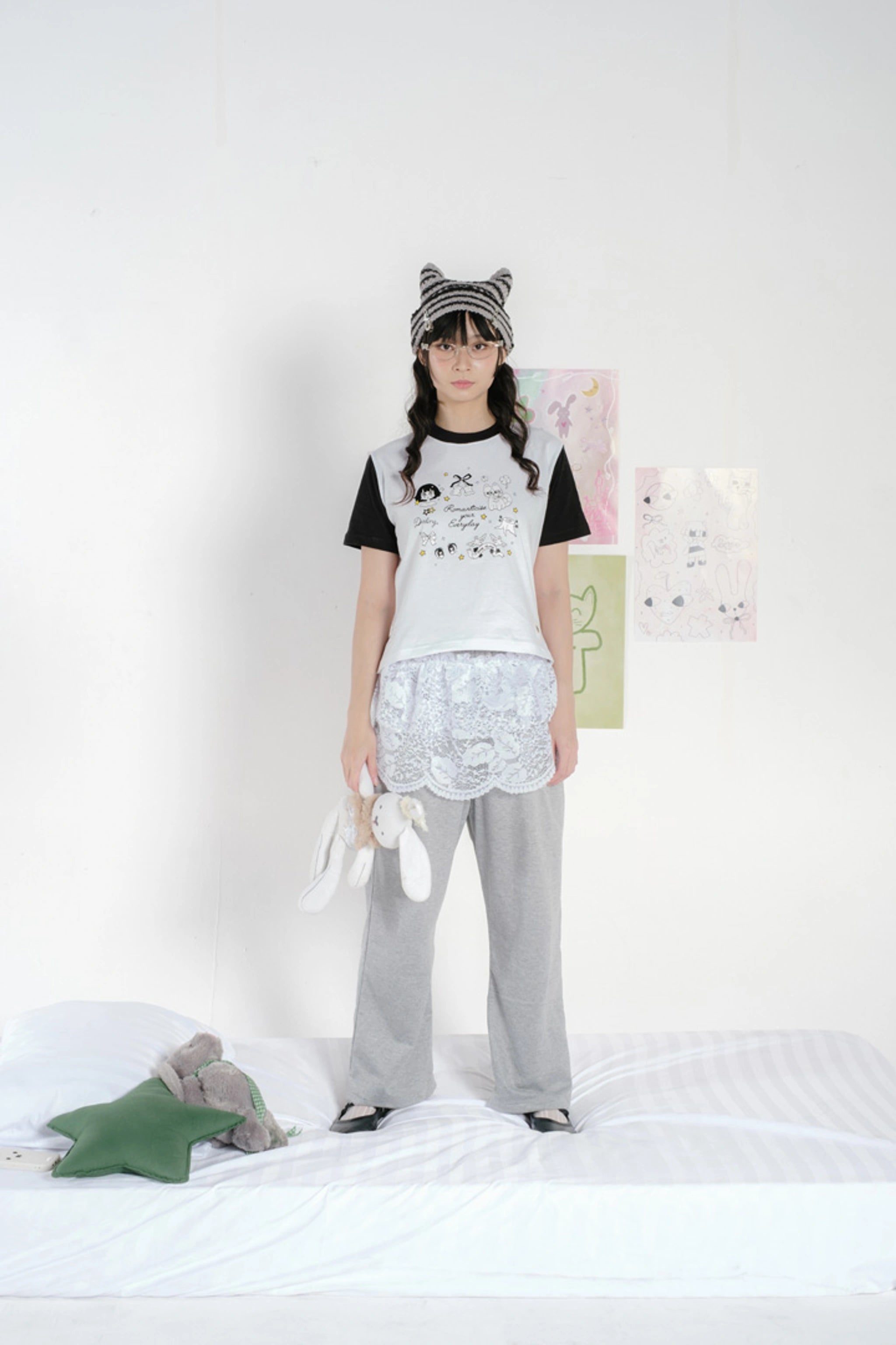 Person wearing a Tome Ame crop t-shirt.