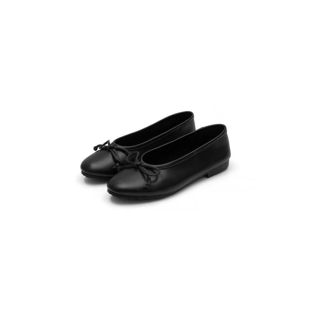 Pair of black flatshoes with laces on a white background
