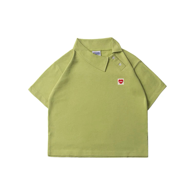 Green polo shirt with a small red heart logo by notyourcompany on a white background