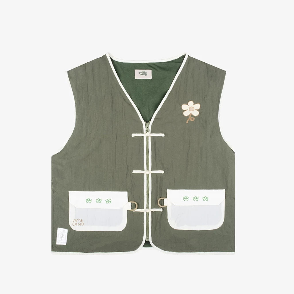 Green vest by Tome Ame with white accents on a light gray background