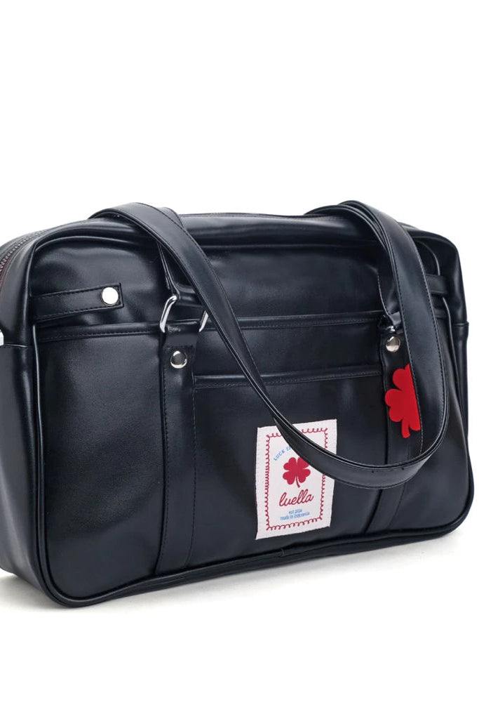 Black leather tote bag by Luella with a red and white tag on a white background