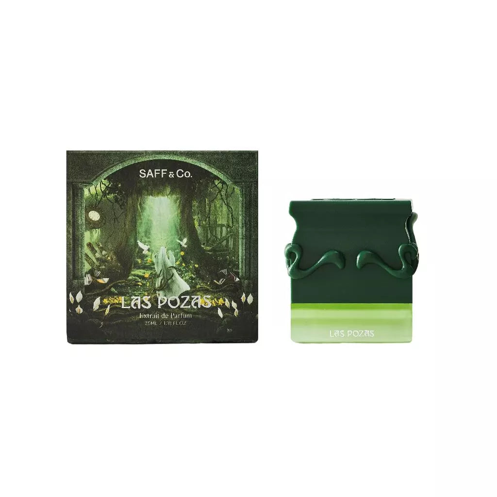 Green perfume bottle and packaging with 'Saff & Co.' branding on a white background