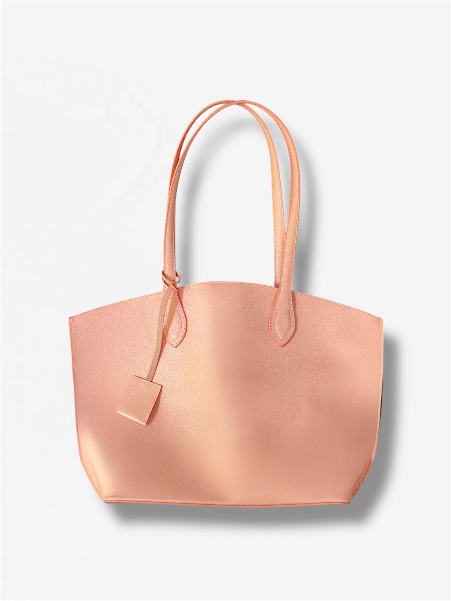 Peach tote bag from Masagi on a light gray background