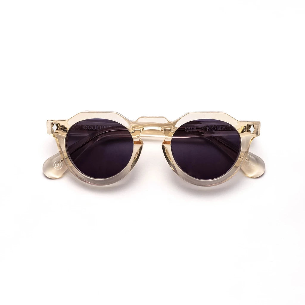 Gold-framed sunglasses by Cool Uncle with dark lenses on a white background