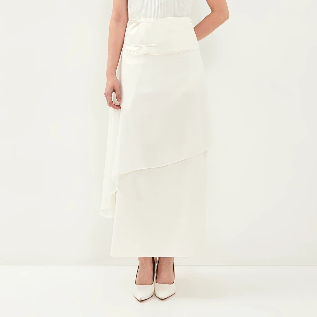 Person wearing a white skirt by Isoos Studios on a plain background