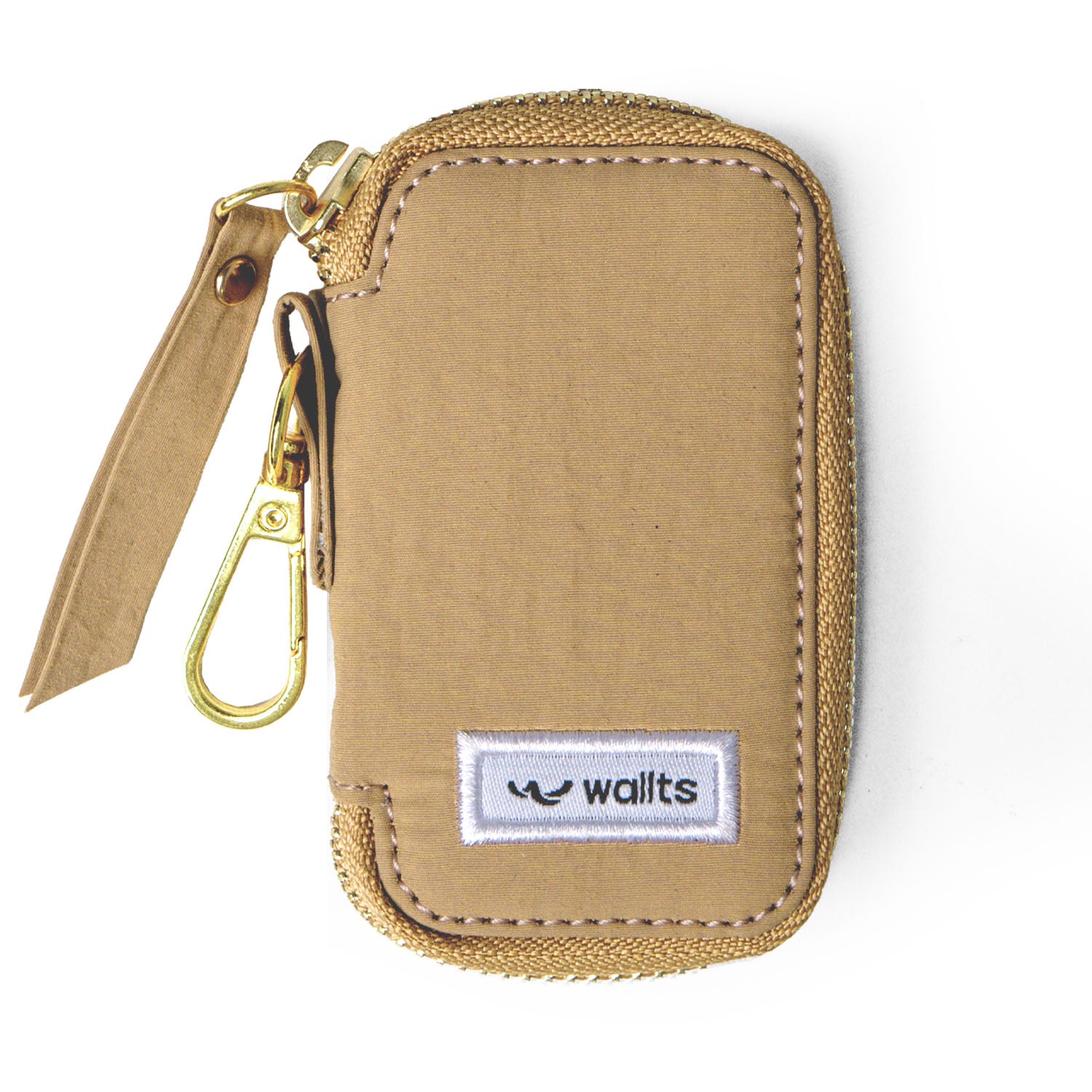 A light brown key organizer by Wallts with gold carabiner on a white background