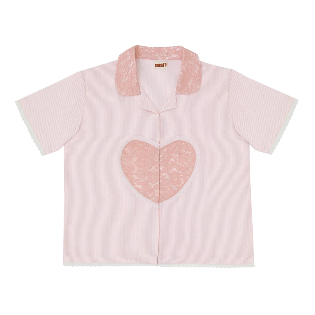 Pink shirt with a heart design on a white background