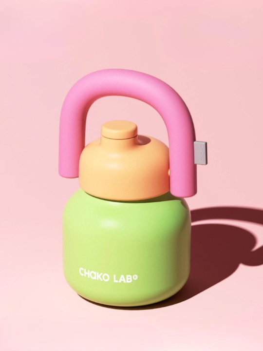 A Chako Lab vacuum thermos with a pink and green color scheme, featuring a handle.