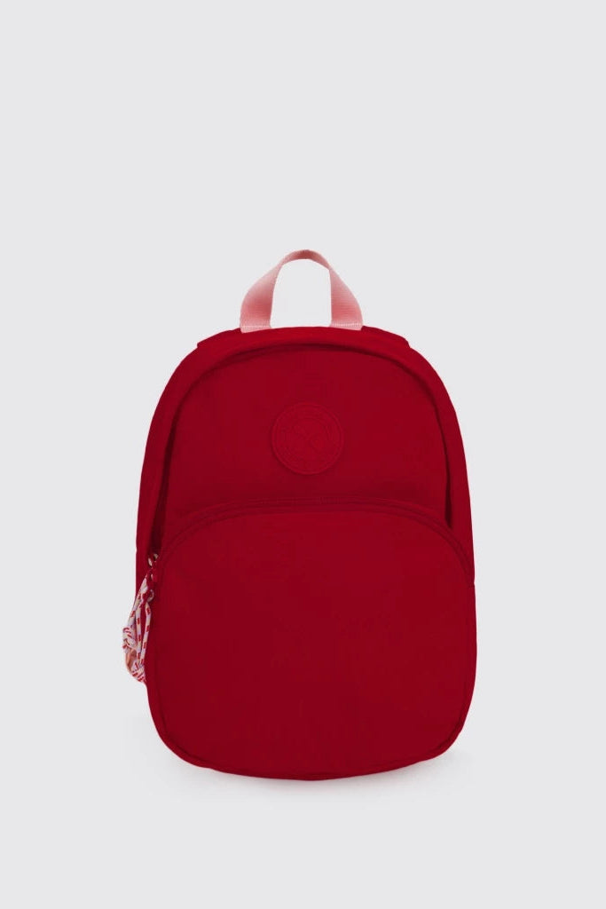 A small red backpack by Exsport Bag with a top carry handle, shown from the back against a light gray background.