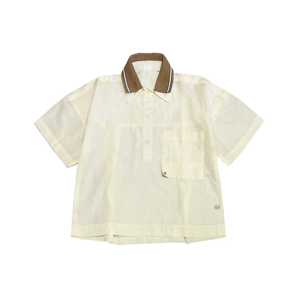 Beige polo shirt by Hunting Fields with brown collar on a white background