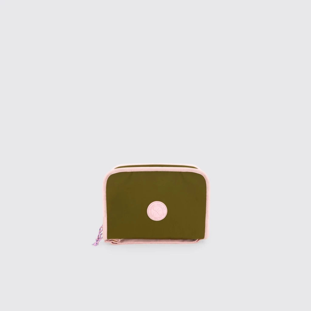 Green Export Bags Everyday Multipurpose Pouch with pink zipper on a light gray background