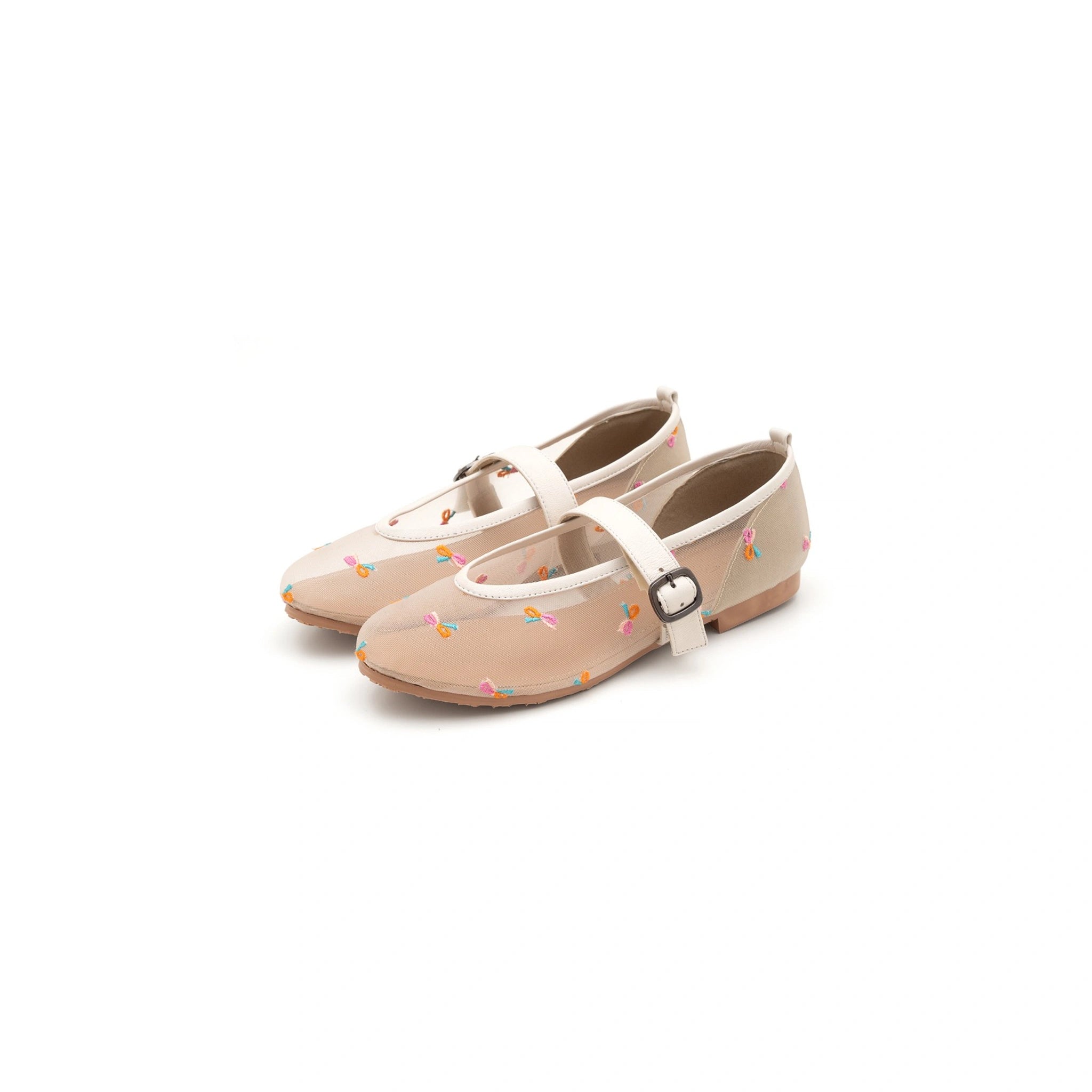 A pair of white ballet flatshoes with a candy pattern and white straps, displayed against a white background.