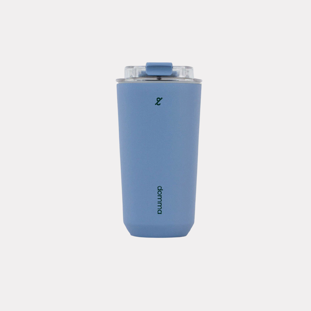 A blue stainless steel insulated travel mug with a Domma brand logo on the front.