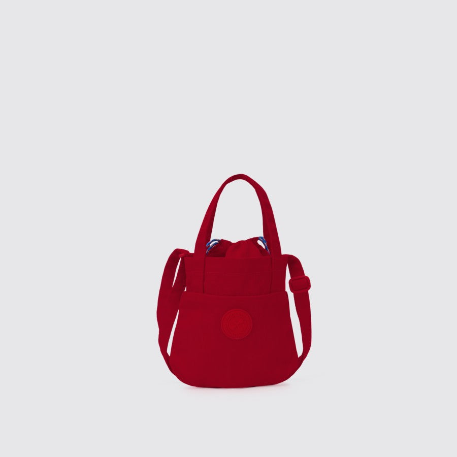 A red mini sling bag with a solid color, nylon material, and a water-repellent surface from Exsport Bags.