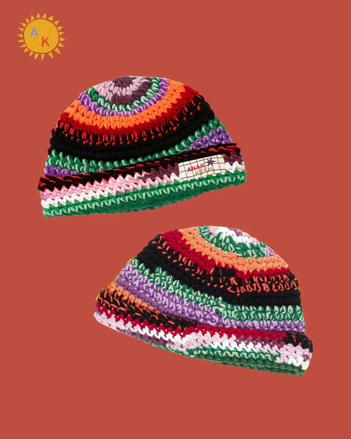 Two colorful striped beanies hat on a brown background