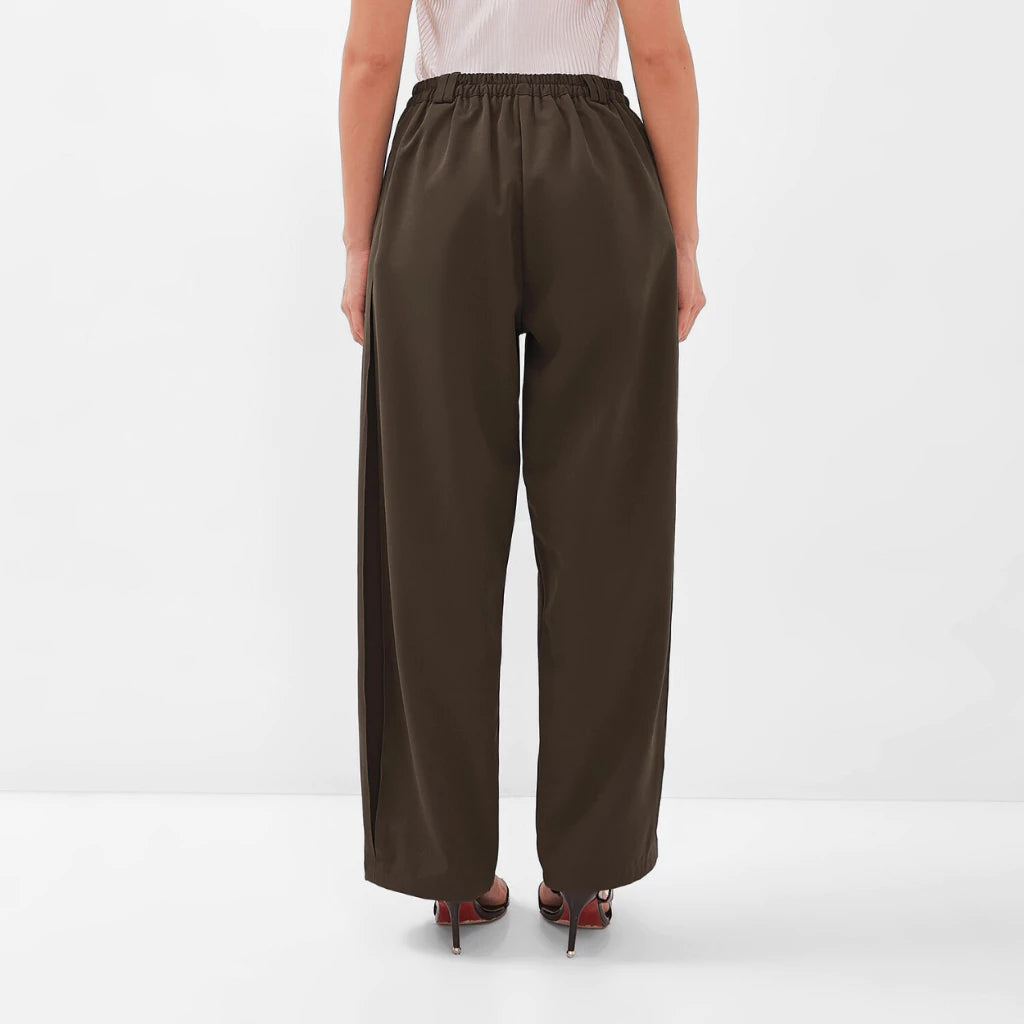 Brown wide-leg pants by Isoos Studios worn by a person on a white background
