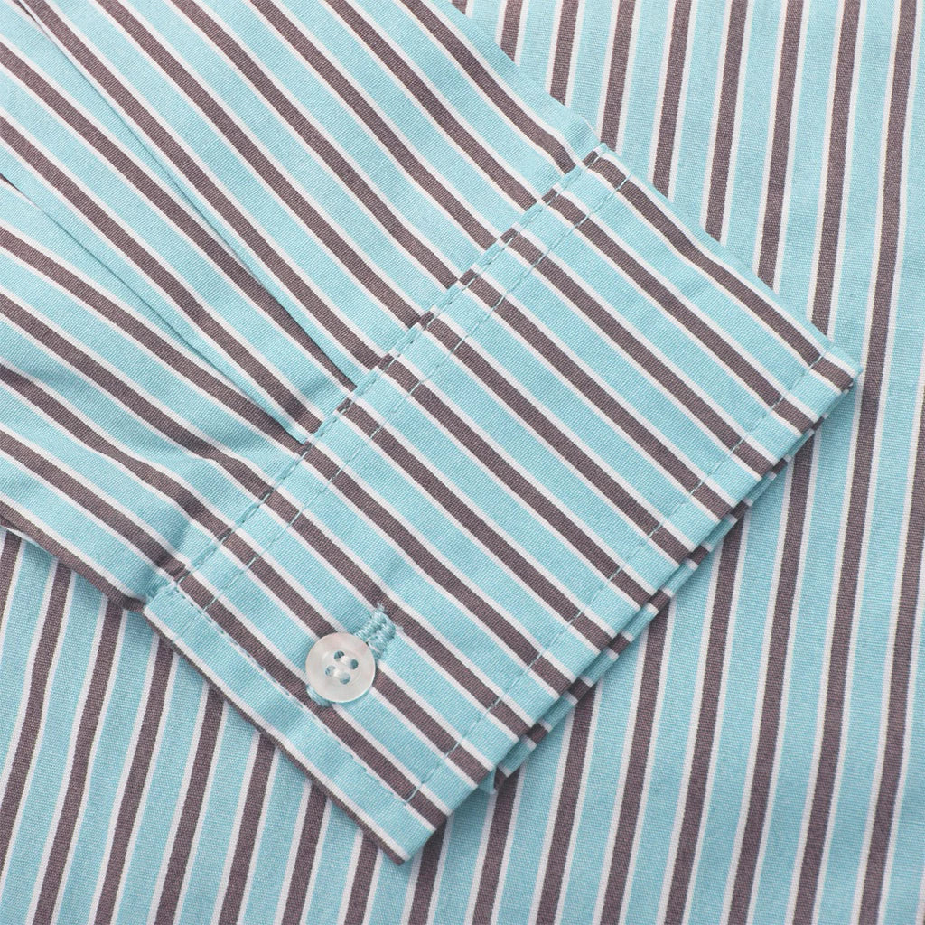 Close-up of a folded shirt with blue and brown stripes by notyourcompany