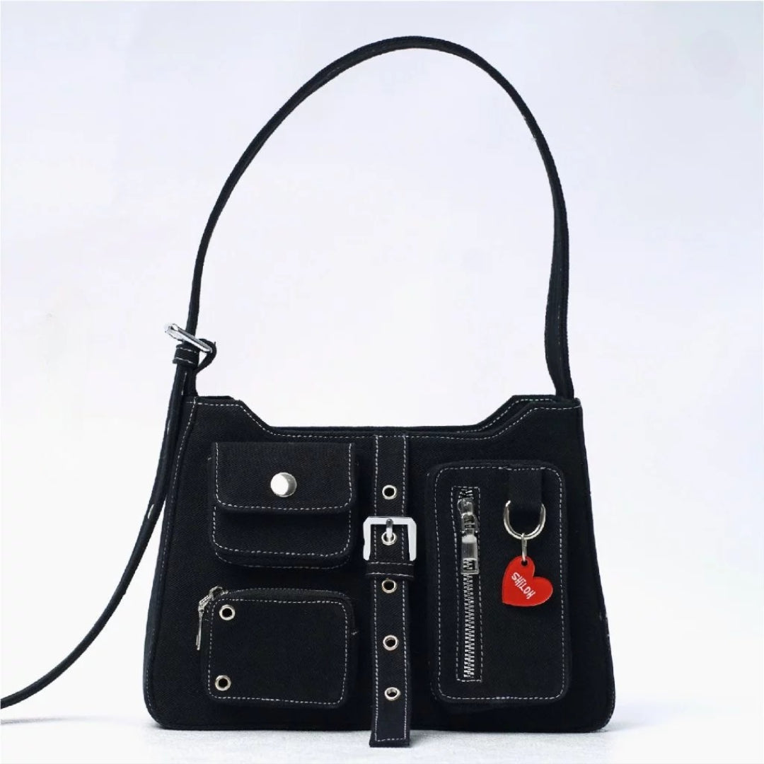 Black denim handbag with multiple pockets and a strap on a light gray background

Tas tangan wanita berwarna hitam berbahan denim dengan banyak saku dan tali pada latar belakang abu-abu muda