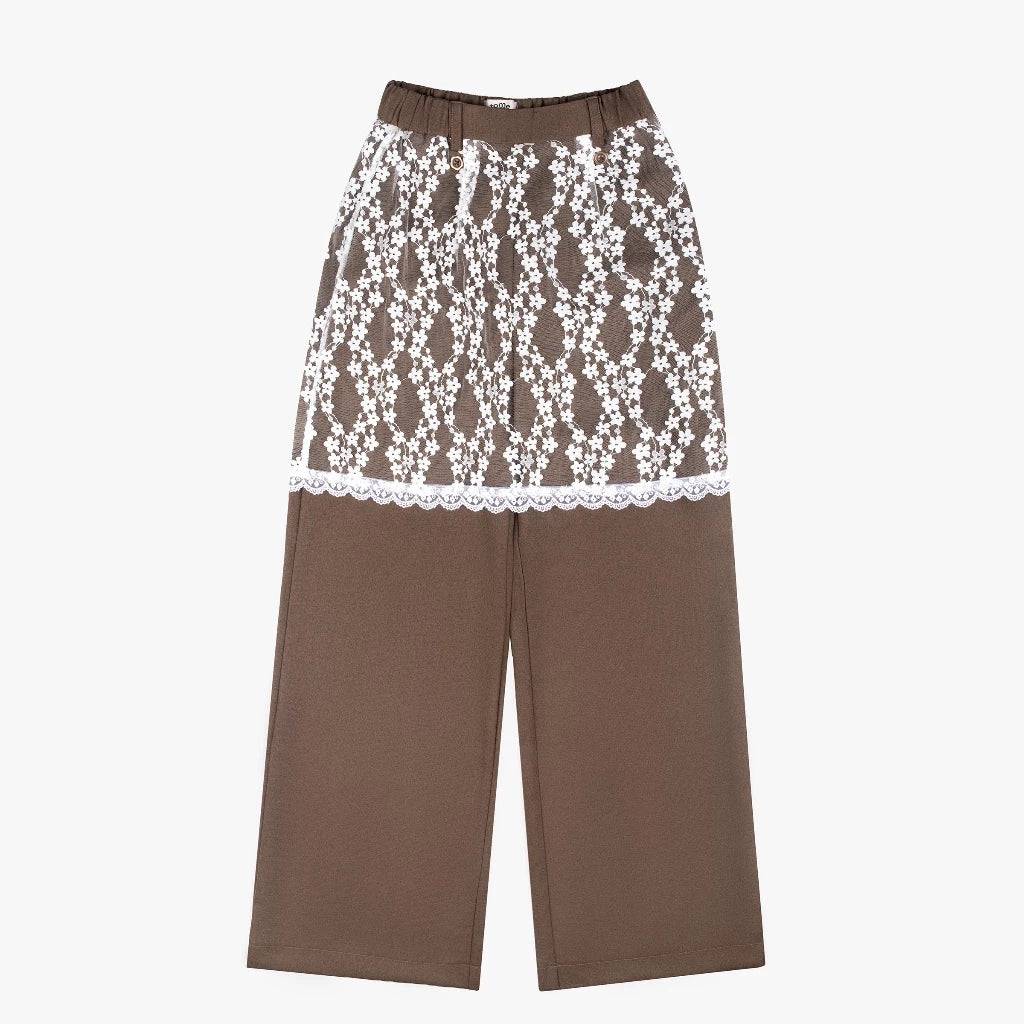 Brown pants by Tome Ame with white lace trim on a white background