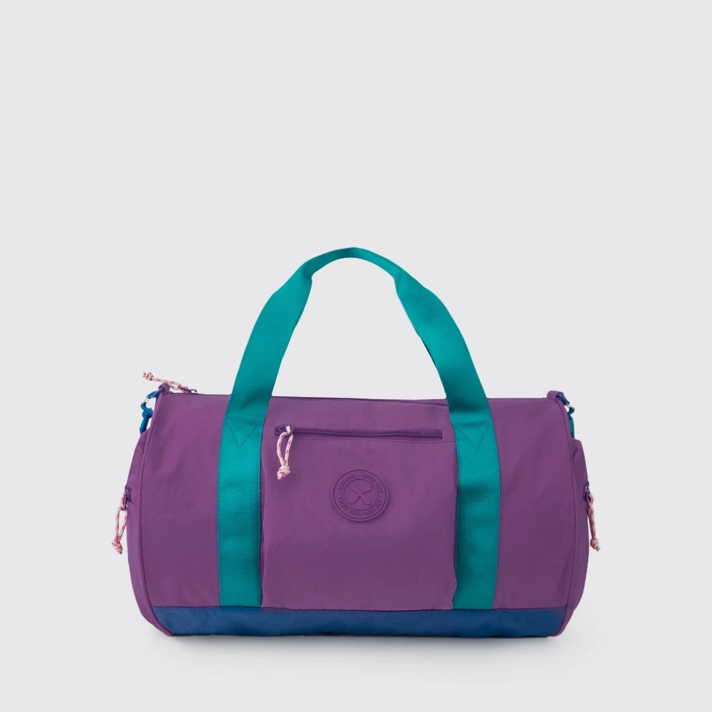 Purple and teal Export Bags duffel bag on a light gray background