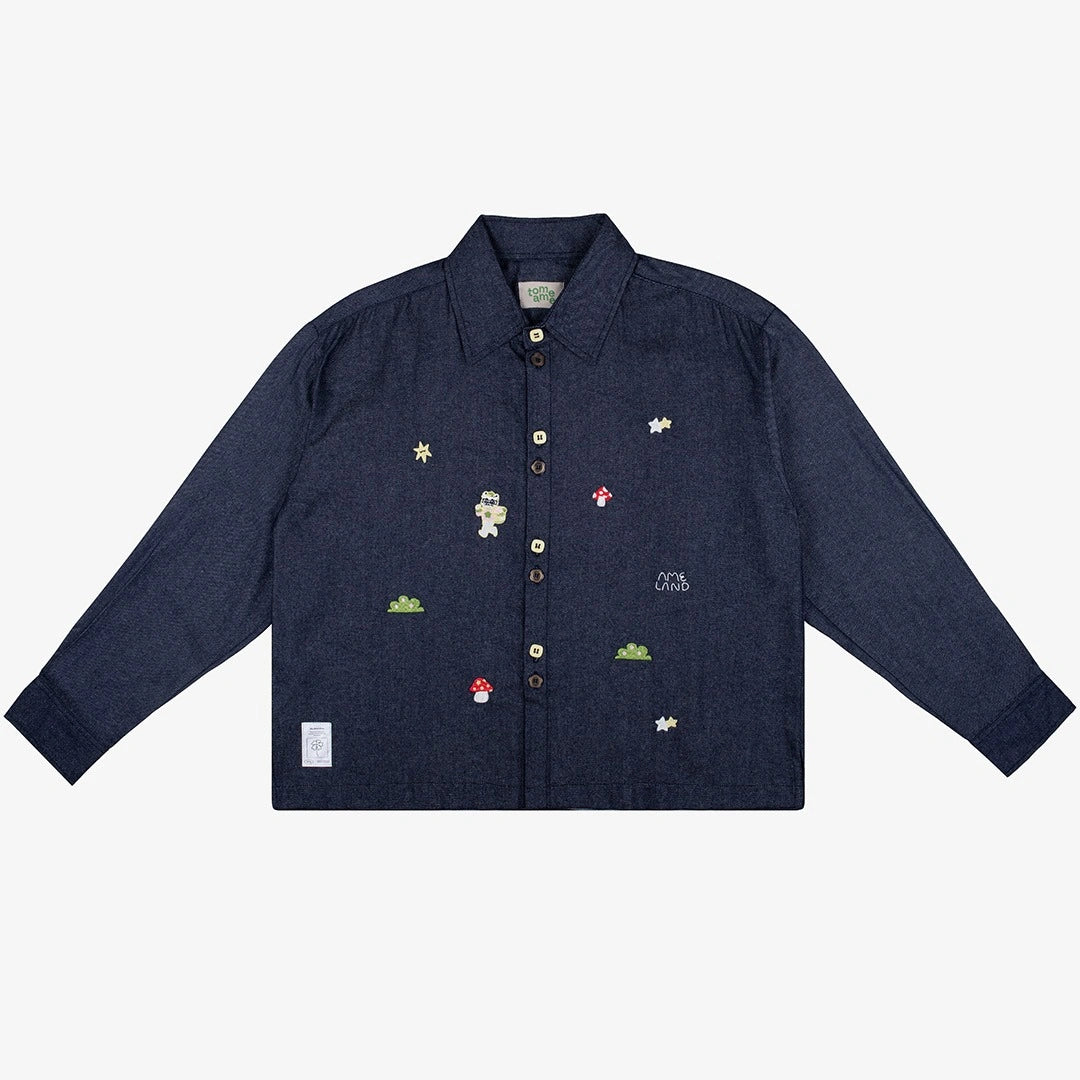 Navy blue denim shirt by Tome Ame with embroidered designs on a white background