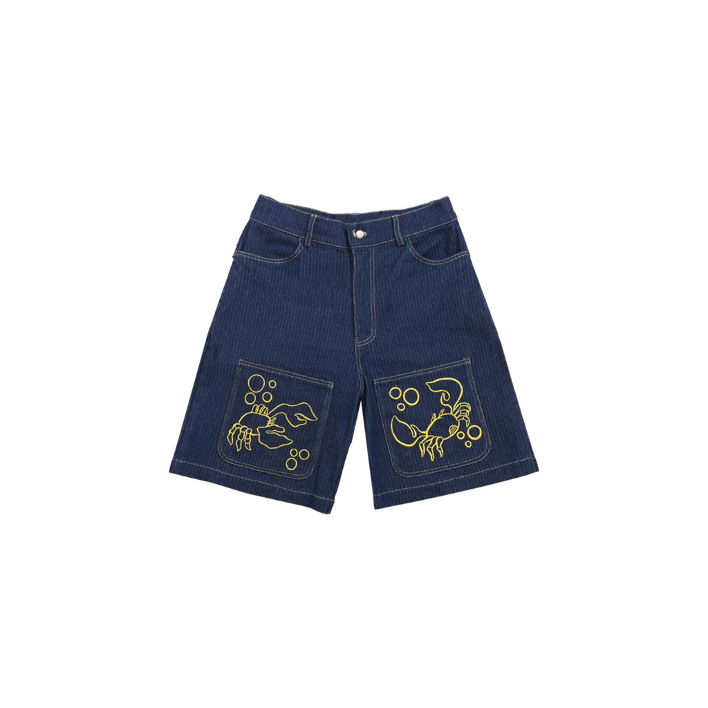 Blue denim jorts pants with yellow embroidery on a white background