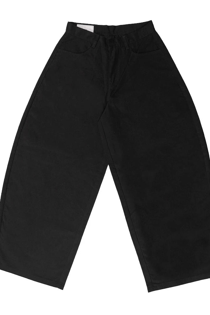 Black barrel pants for women featuring a high-waist fit and exaggerated curved-leg silhouette. Designed with a structured oversized shape, wide legs, and tapered hem, these women’s barrel pants offer a modern minimalist look suitable for casual and contemporary styling.