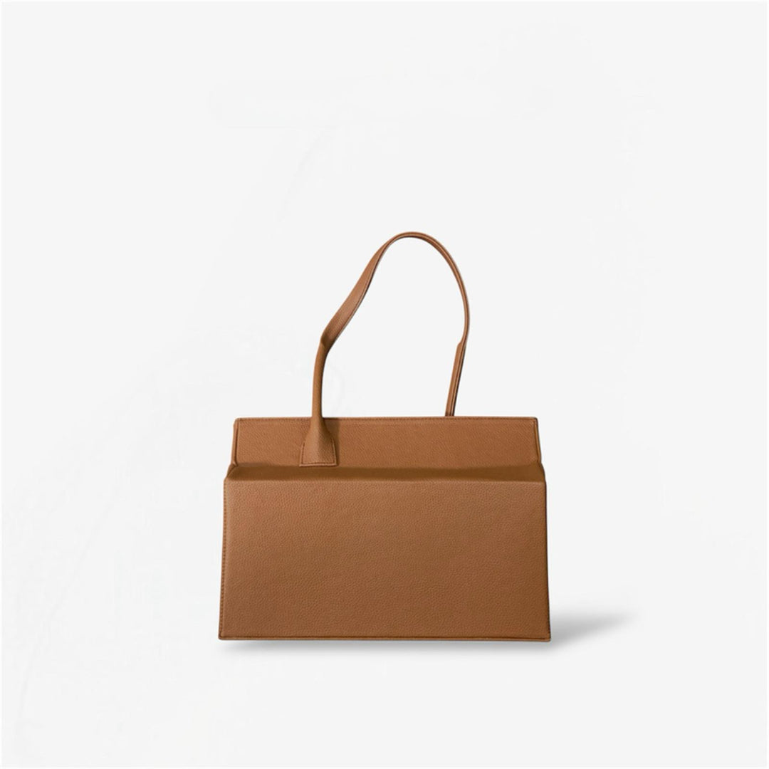 Brown leather shoulder bag from Masagi on a light gray background