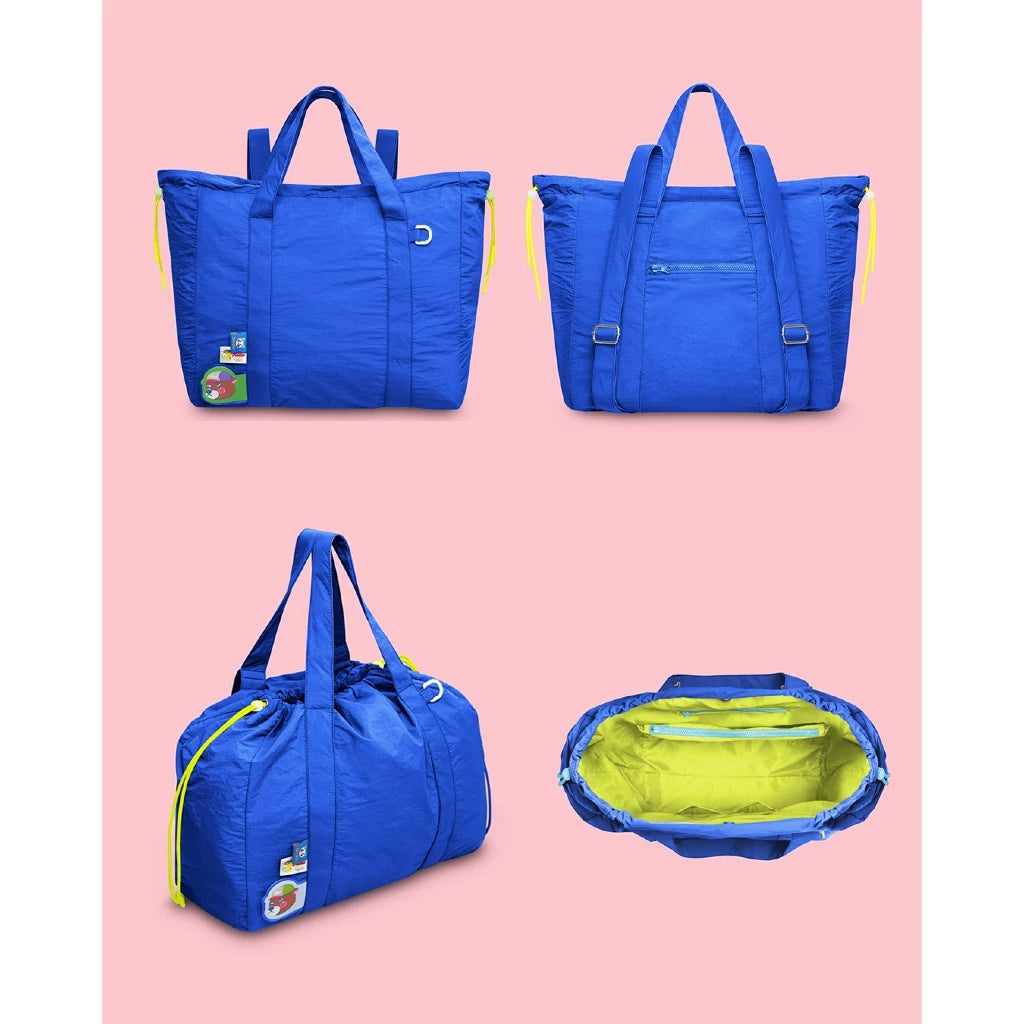 Blue duffel bag by Oh.Irv with yellow accents on a pink background