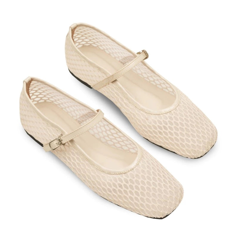 Pair of broken white mesh flatshoes with a strap on a white background