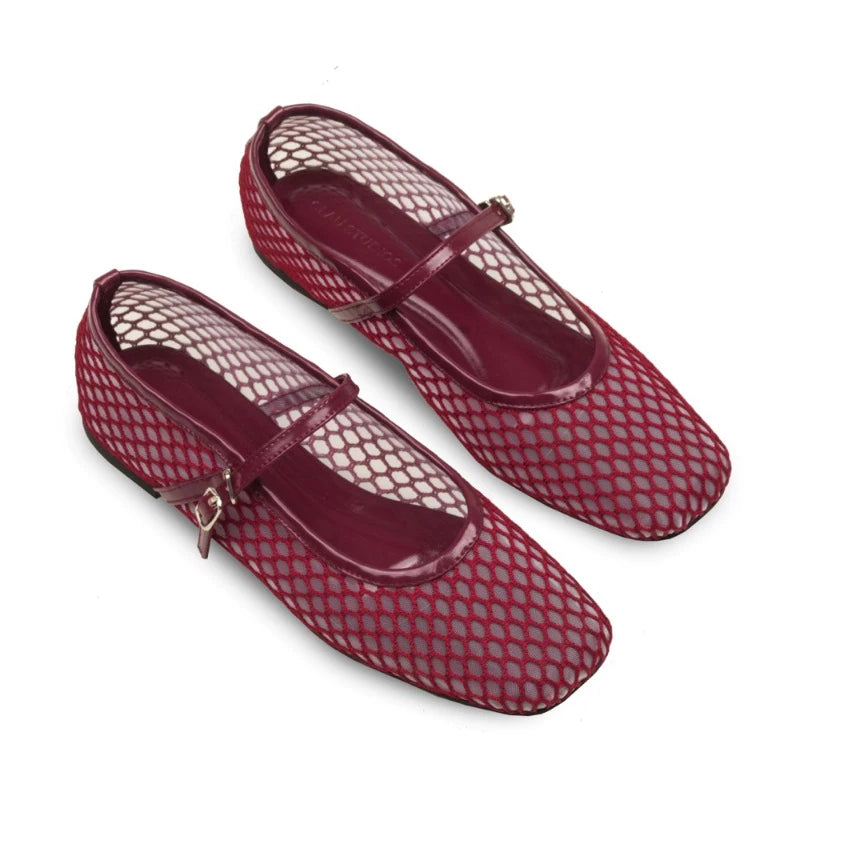 Pair of maroon flatshoes with mesh design on a white background