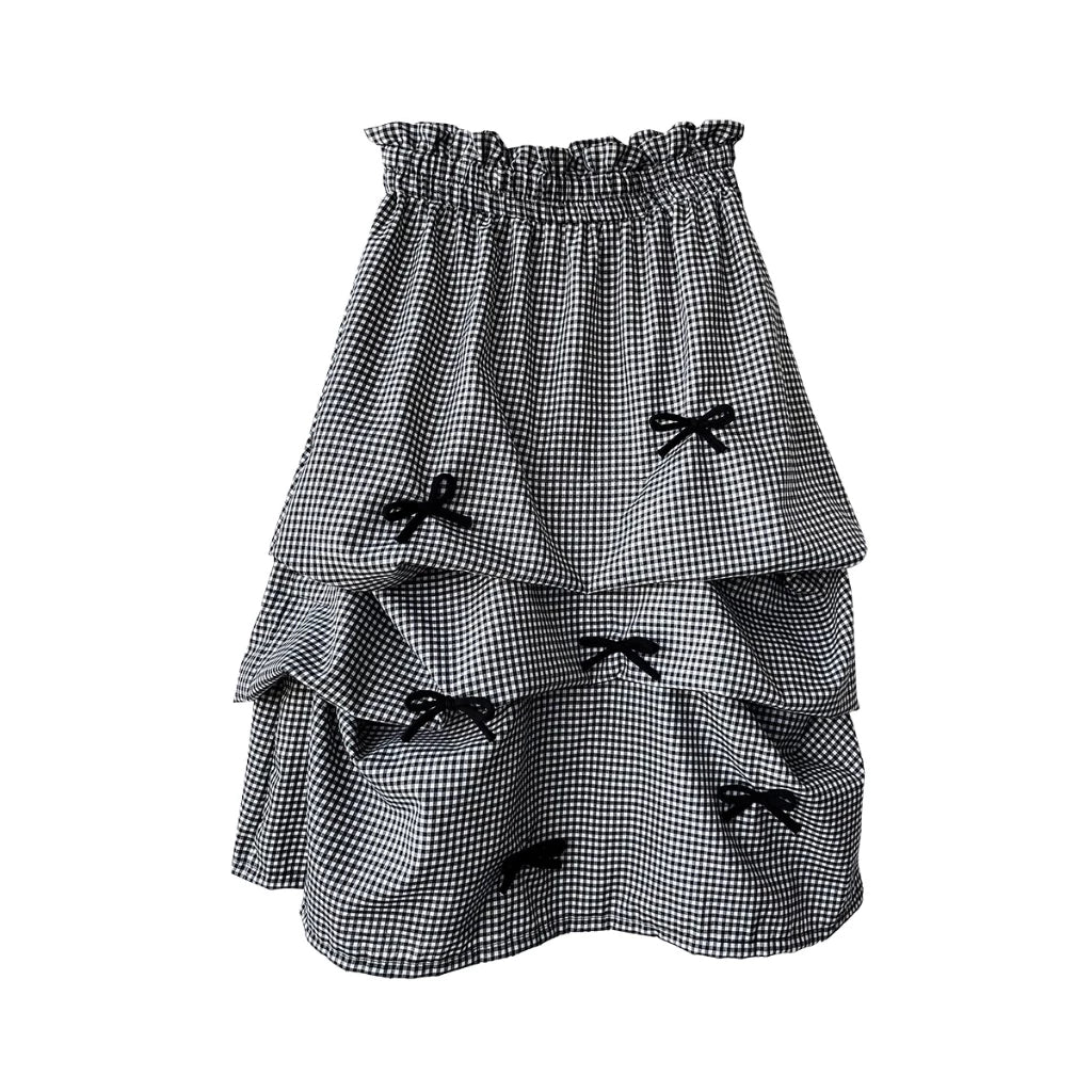 Black and white checkered skirt with bow details on a white background